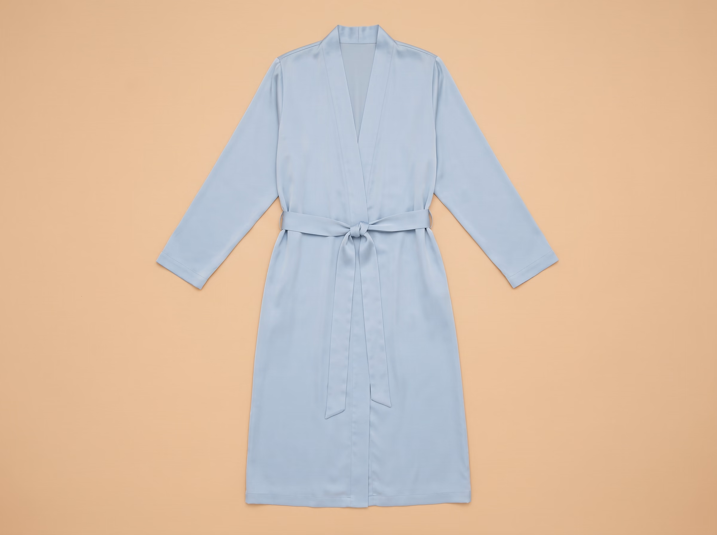 The Chergui robe in Bleu voile, laid flat, from the front.