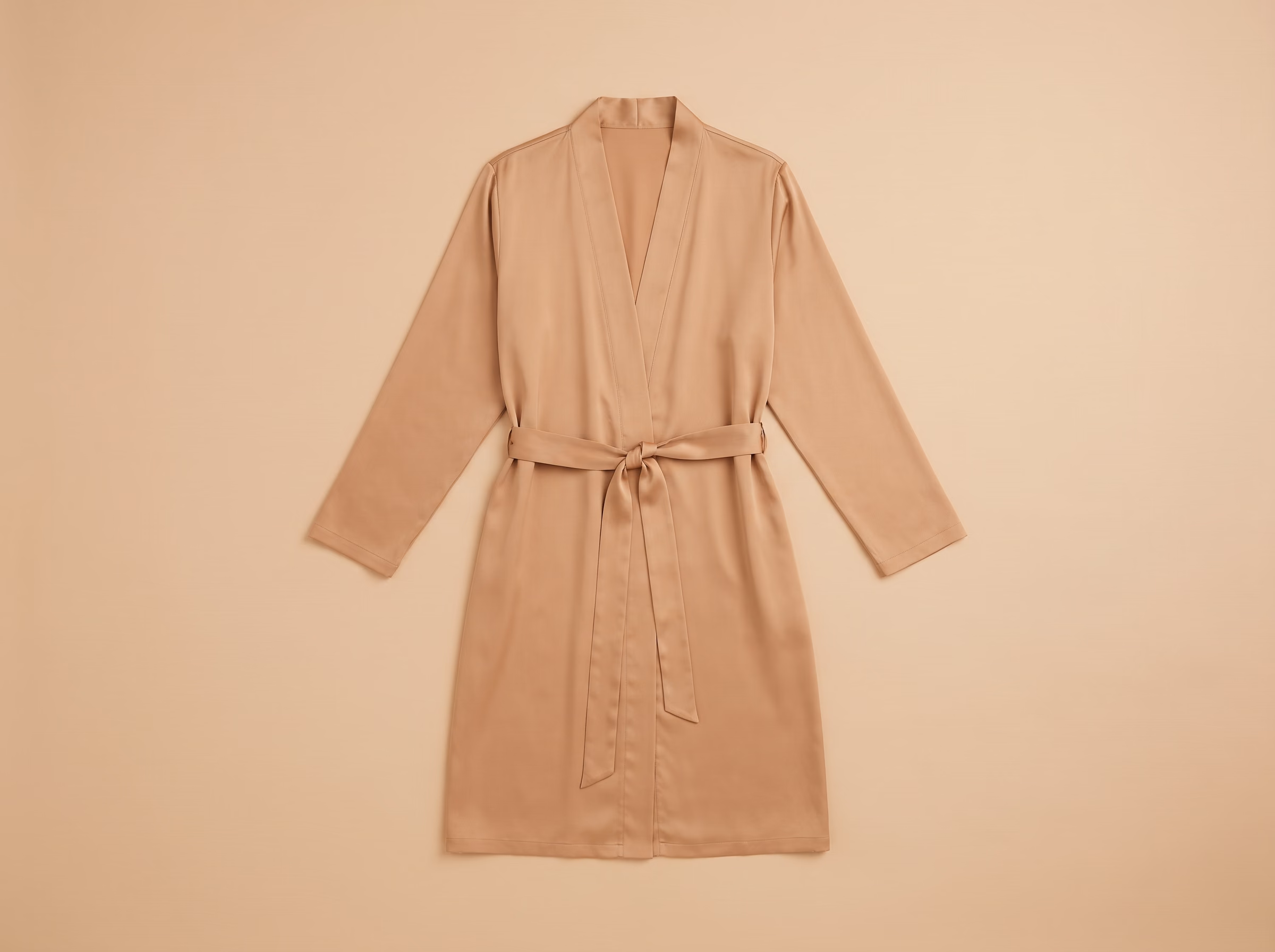The Zellige robe in Amande, laid flat, from the front.